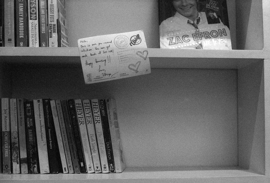 Archive boxes and old handwritten documents on a shelf